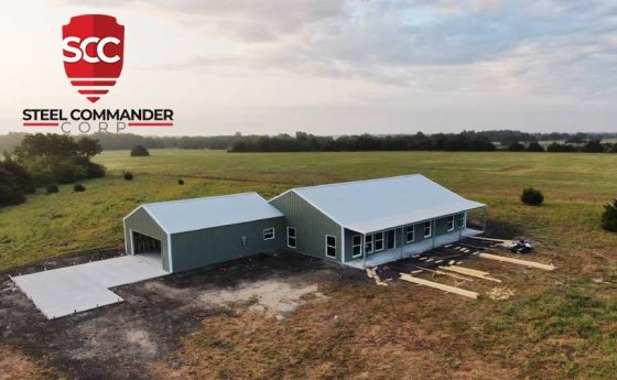 Green Steel Home with White Roof and Detached Two Car Steel Garage