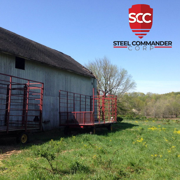 Side of Steel Barn with Trailers