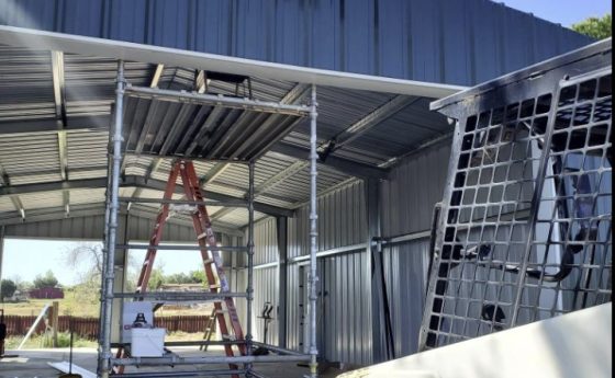 Laborer on Steel Roof