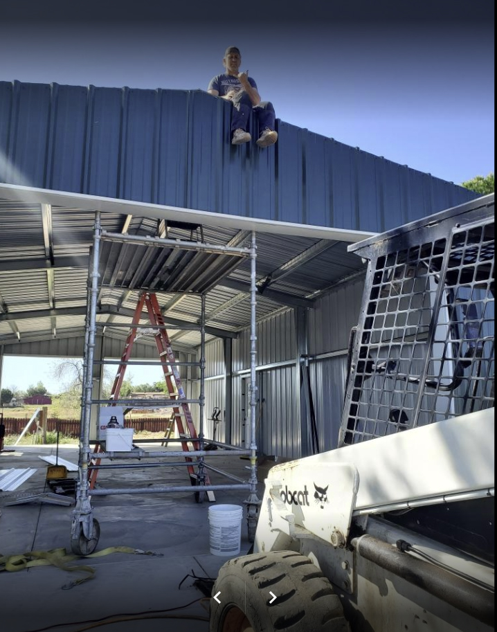 Laborer on Steel Roof