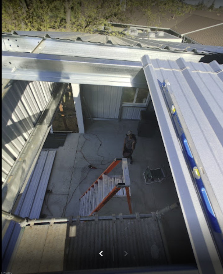 Interior of Steel Building From Perspective of Roof