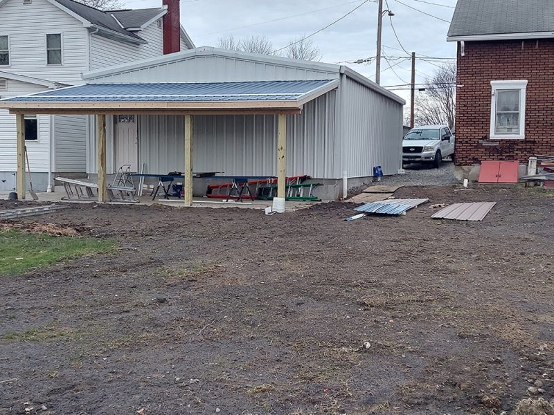 Exterior Back Side of Residential Steel Home with Overhang