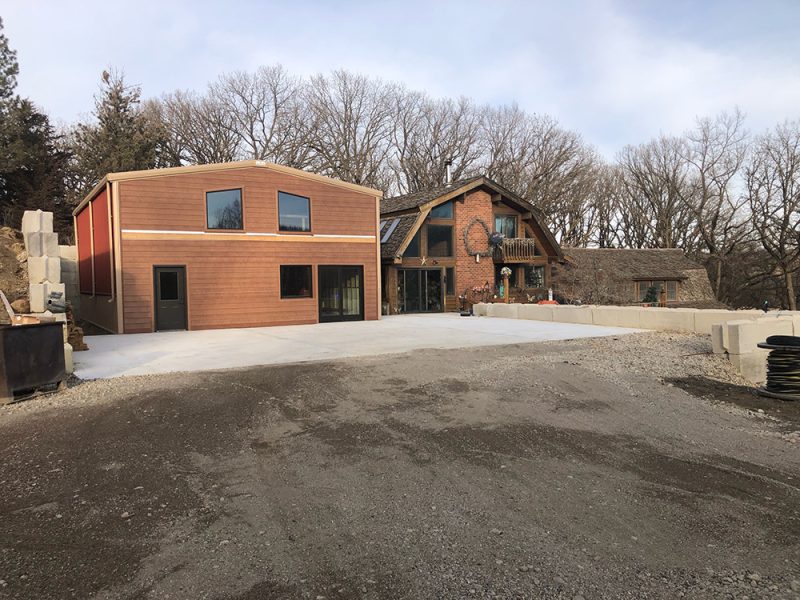 Steel Home with Wood Siding and Brick Façade