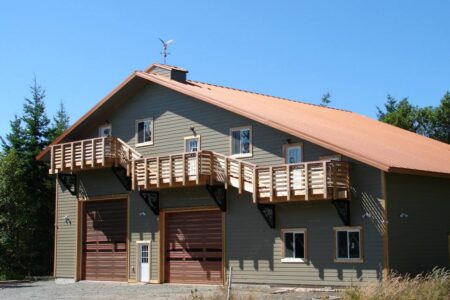 Two Story Green Steel Home with Pitched Roof