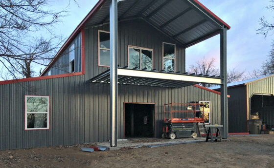 Large Two-Story Grey and Red Steel Home