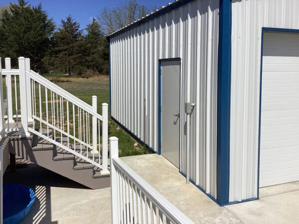 Side View of White and Blue Steel Garage